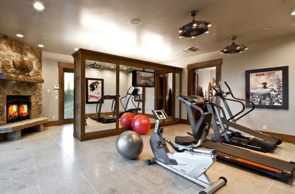 Mirrored cabinets in the homy gym provide additional storage space