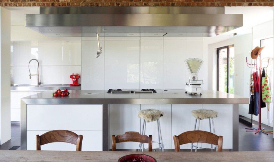 Modern kitchen in white with a steel countertop island