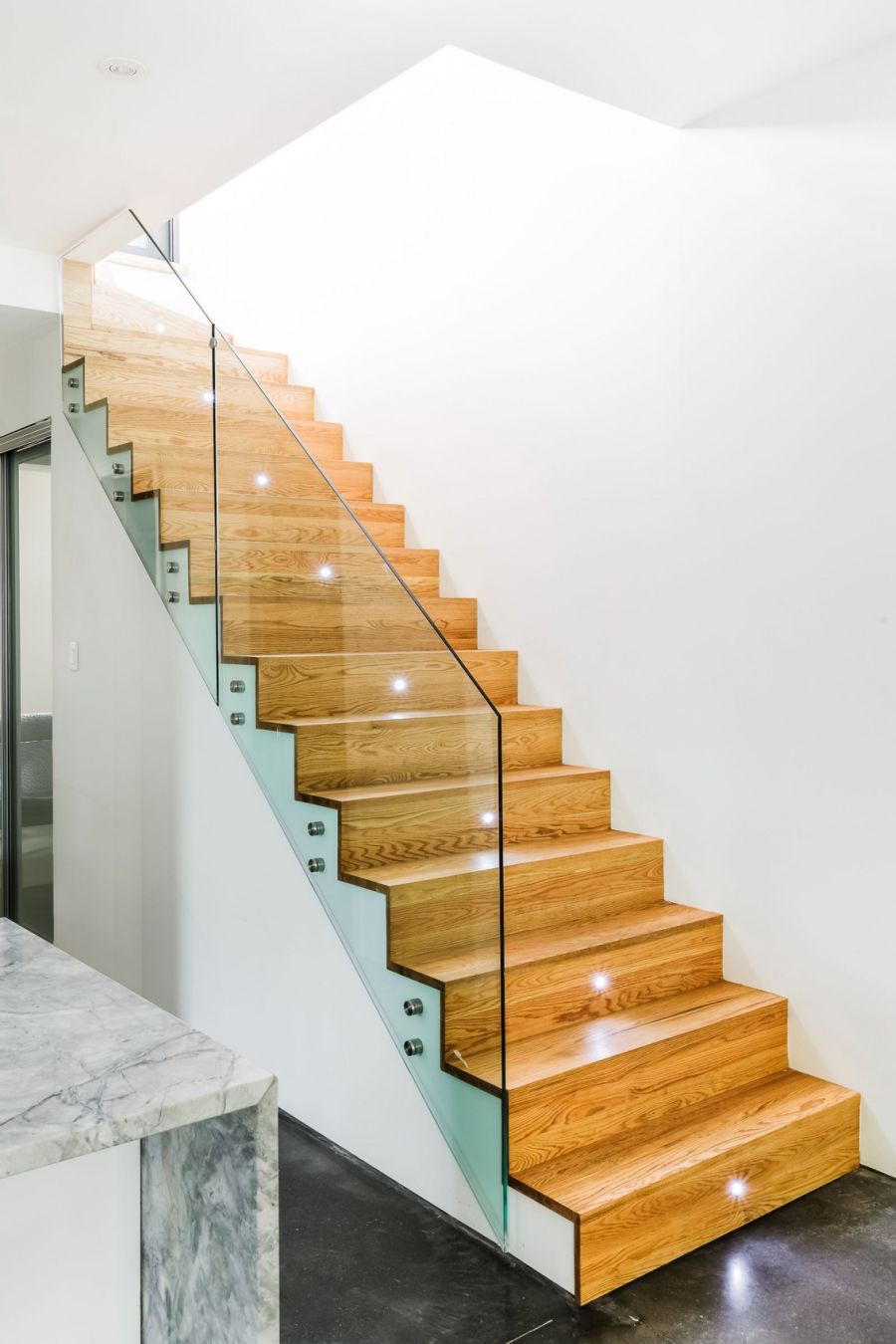 Modern staircase with glass railing