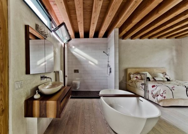 Open bathroom and bedroom design ideal for a compact bachelor pad