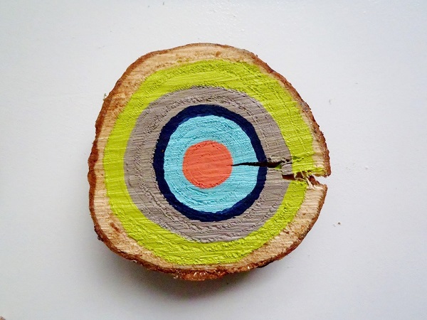 Painted tree ring wall art