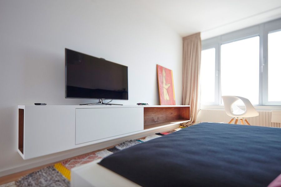 Sleek floating shelf below the TV