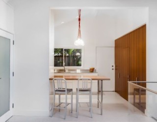 Small Contemporary Kitchen Makes Room For Home Office and Laundry