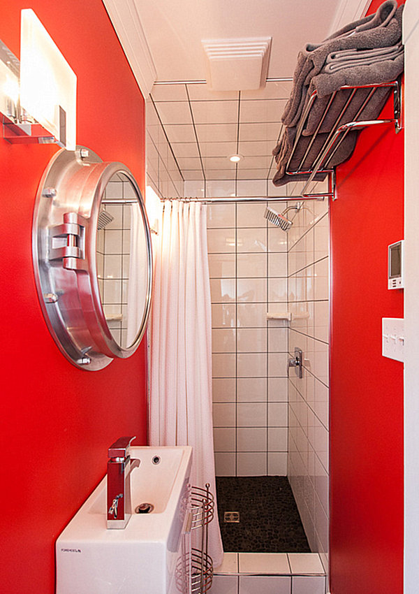 Small red bathroom with overhead storage