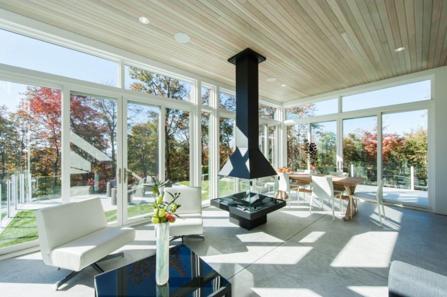 Spacious living room in white with glass walls