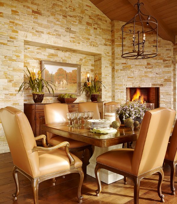 Stone walls and the fireplace give this dining room a truly timeless appeal