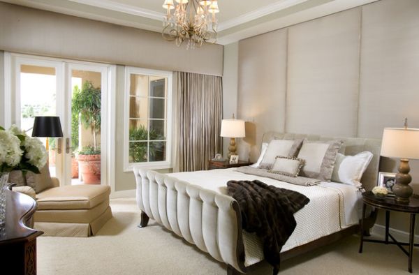 Upholstered wall adds to the luxurious look of the bedroom