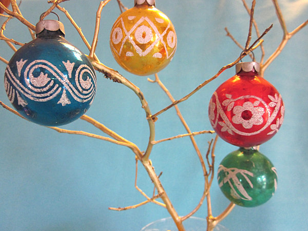 Vintage Christmas ornaments in primary colors