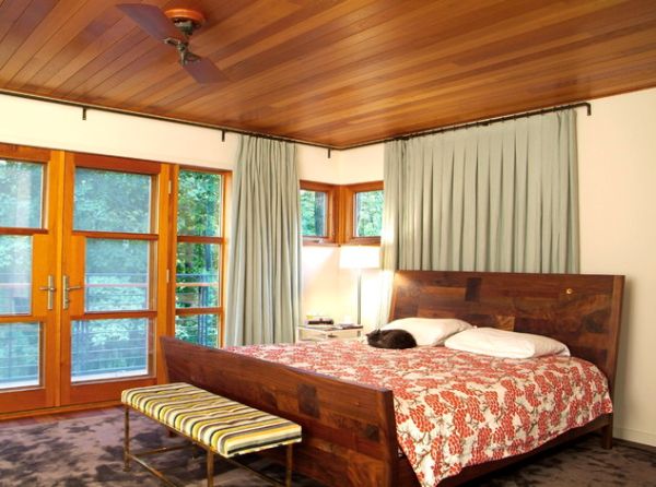 Wooden ceiling steals the show in this bedroom!