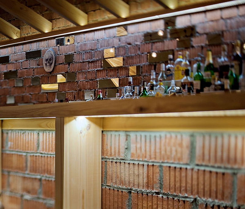 Bare brick backdrop of the attic bar