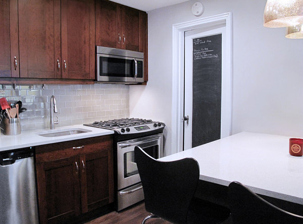 Bathroom door with chalkboard paint in a studio apartment