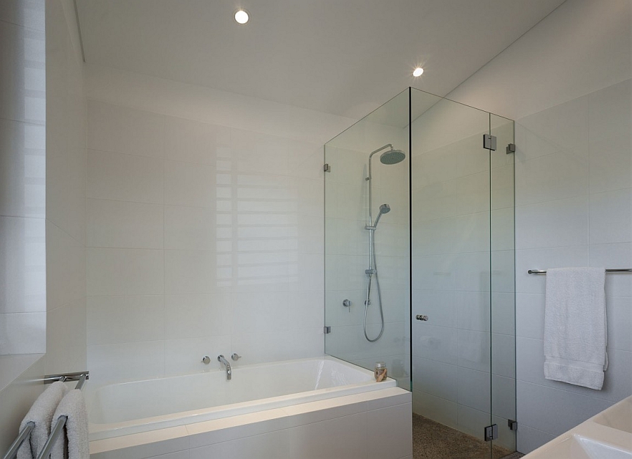 Bathroom with glass shower and bathtub combo