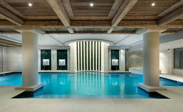 Beautifully lit indoor pool in luxurious French Chalet