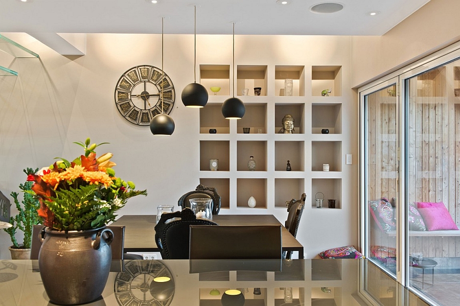 Black pendant lights above the dining table