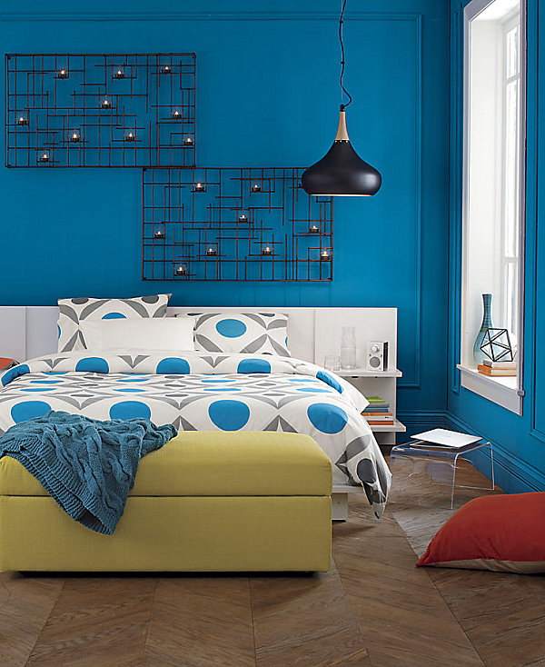 Blue room with orange pillow