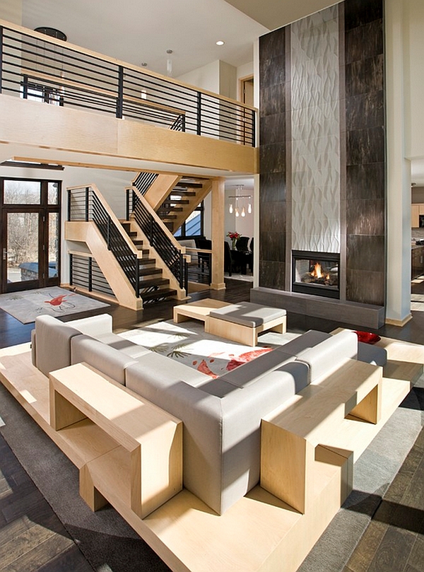 Bold fireplace steel railings define lavish open floor living area