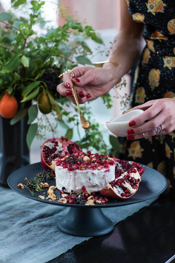 Brie topped with pomegranate seeds