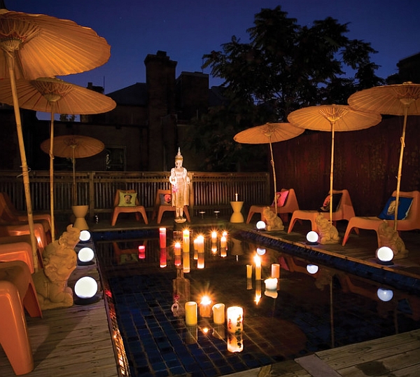 Brilliant lighting and candles create a tranquil reflecting pool with an oriental touch