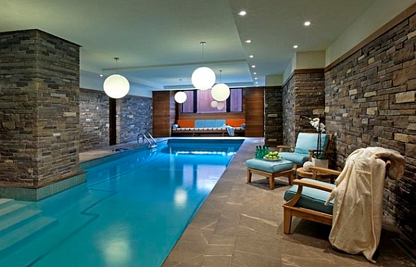 Brilliant pendant lights illuminate the indoor pool