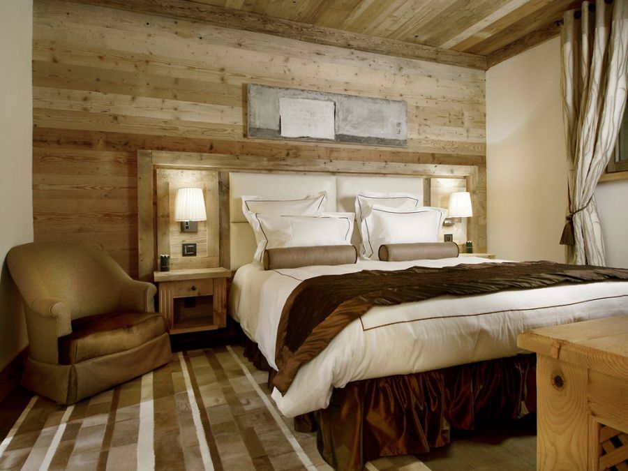 Cabin style bedroom perfectly epitomize the Courchevel spirit