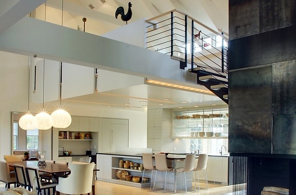 Classy contemporary kitchen and dining area sit neatly under the mezzanine level