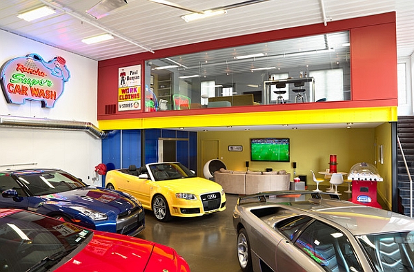 Colorful mezzanine enclosure supported by exposed yellow steel beam