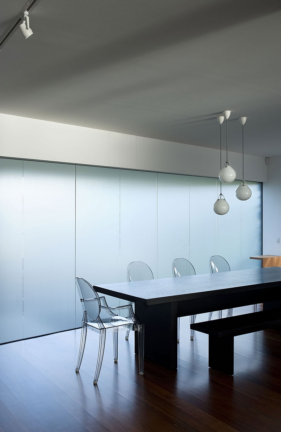 Contemporary dining room with ghost chairs