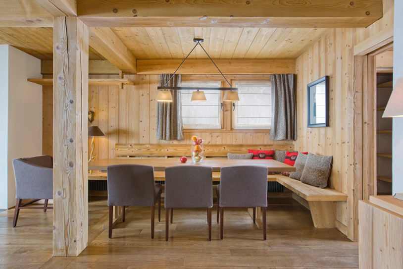 Dining area with wooden walls