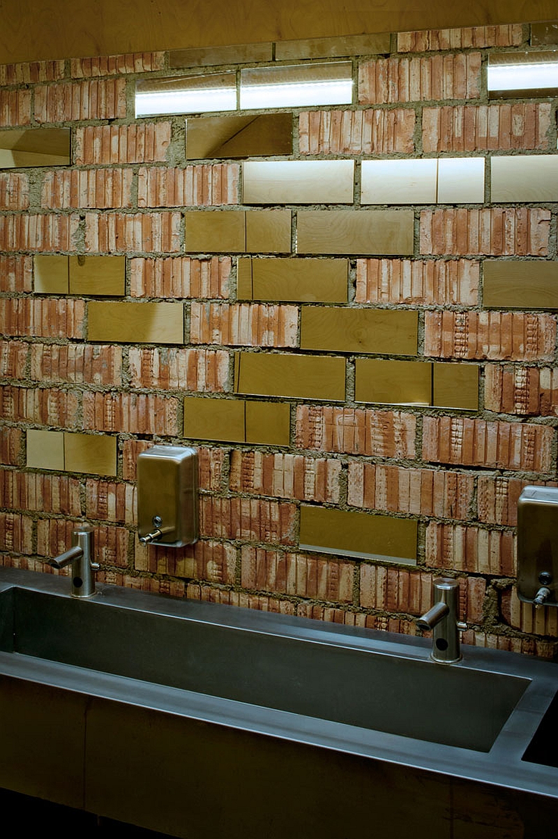 Exposed barebrick surface above the sink