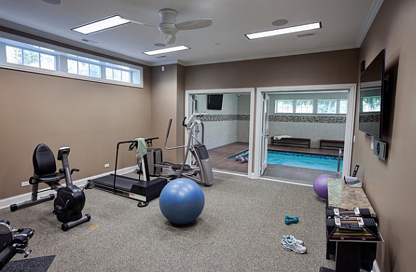 Home gym next to the elegant indoor pool