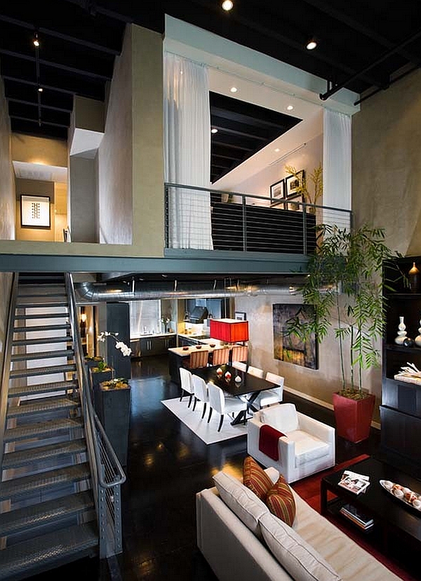 Industrial loft with a mezzanine level that fetaures a guest bedroom