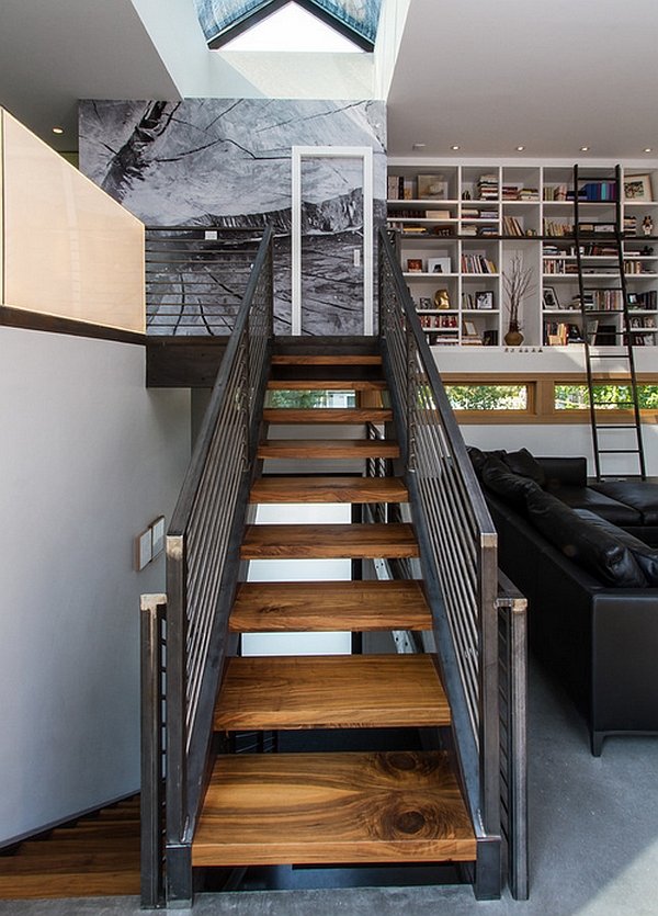 Industrial-styled mezzanine with wooden staircase and metal railing