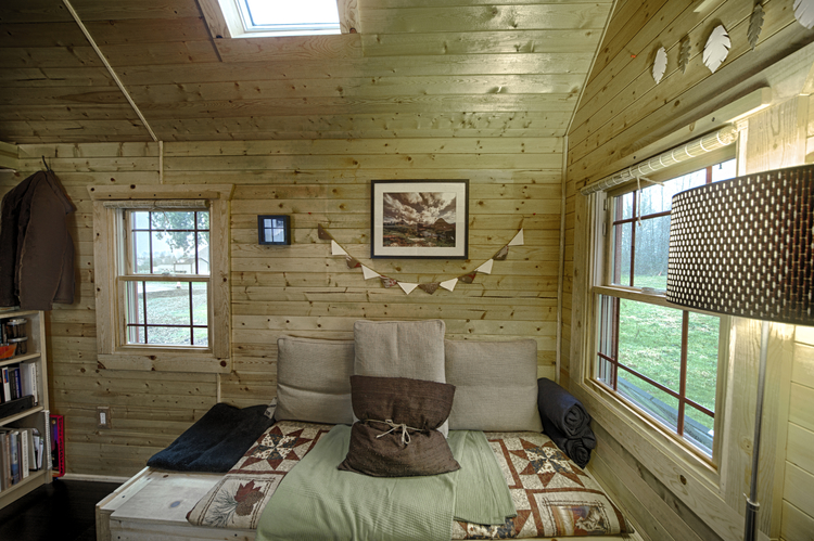 Interior of tiny home with wooden walls