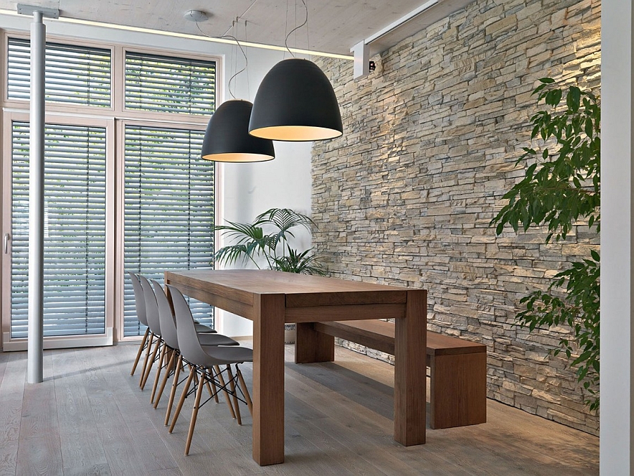 Large black pendant lights above the dining area