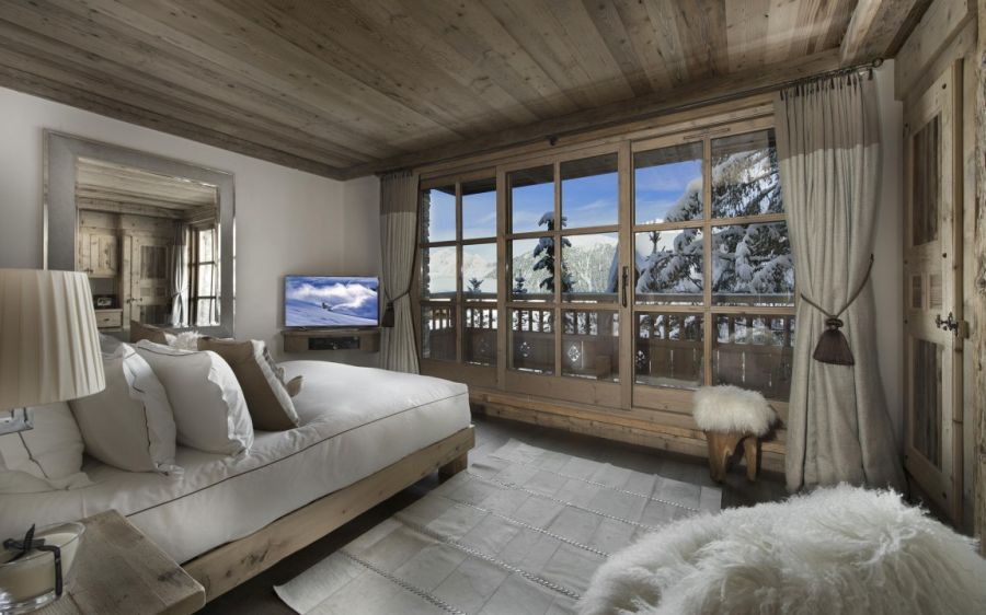 Large glass windows offer grand views of the Alps