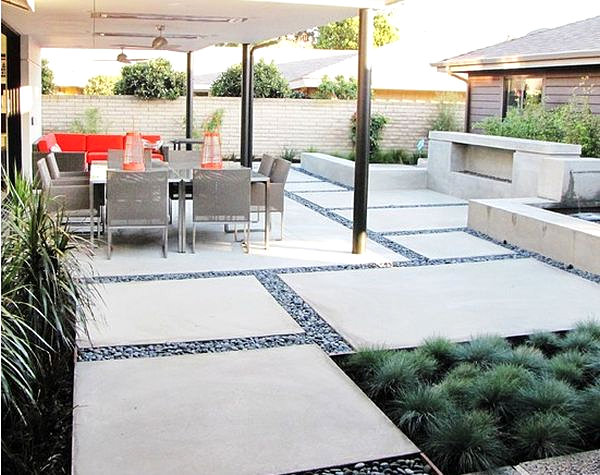 Modern patio design with concrete slabs and pebbles