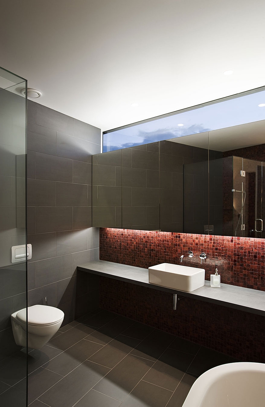 Sleek modern bathroom in grey and red