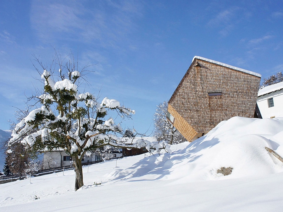 Snow covered slopes surround the Austrian holiday home