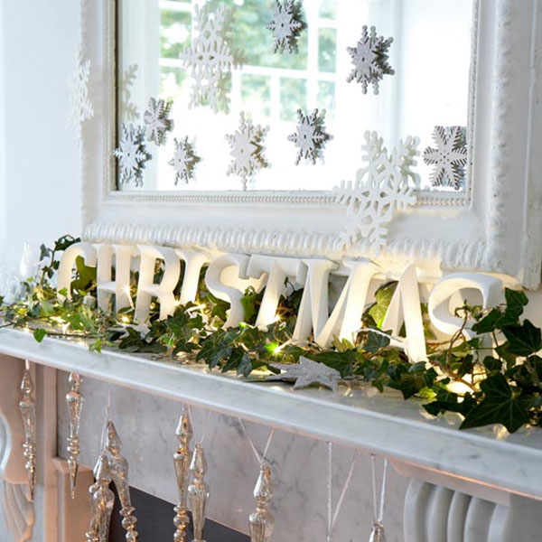 Snowflakes are a fun addition to the Christmas mantel decorations