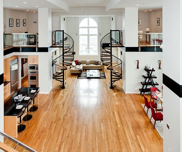 Spacious living room with twin spiral staircases and mezzanines