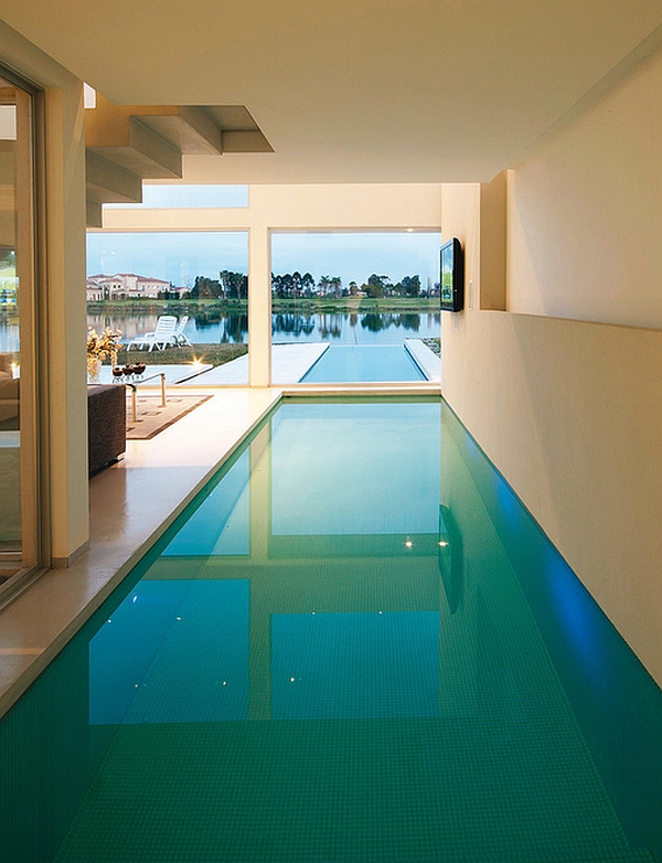 Stylish indoor pool is visually connected with the pool outside