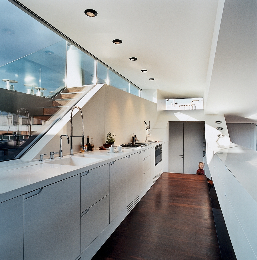 Stylish kitchen in white with recessed lighting