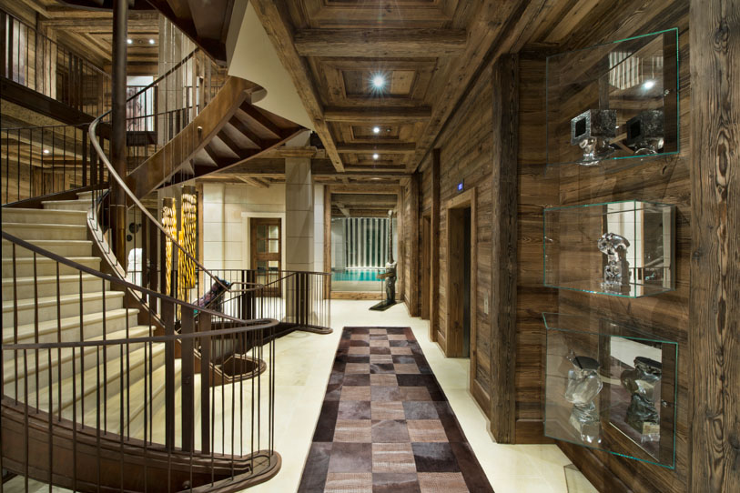 Sweeping staircase leading to the indoor pool