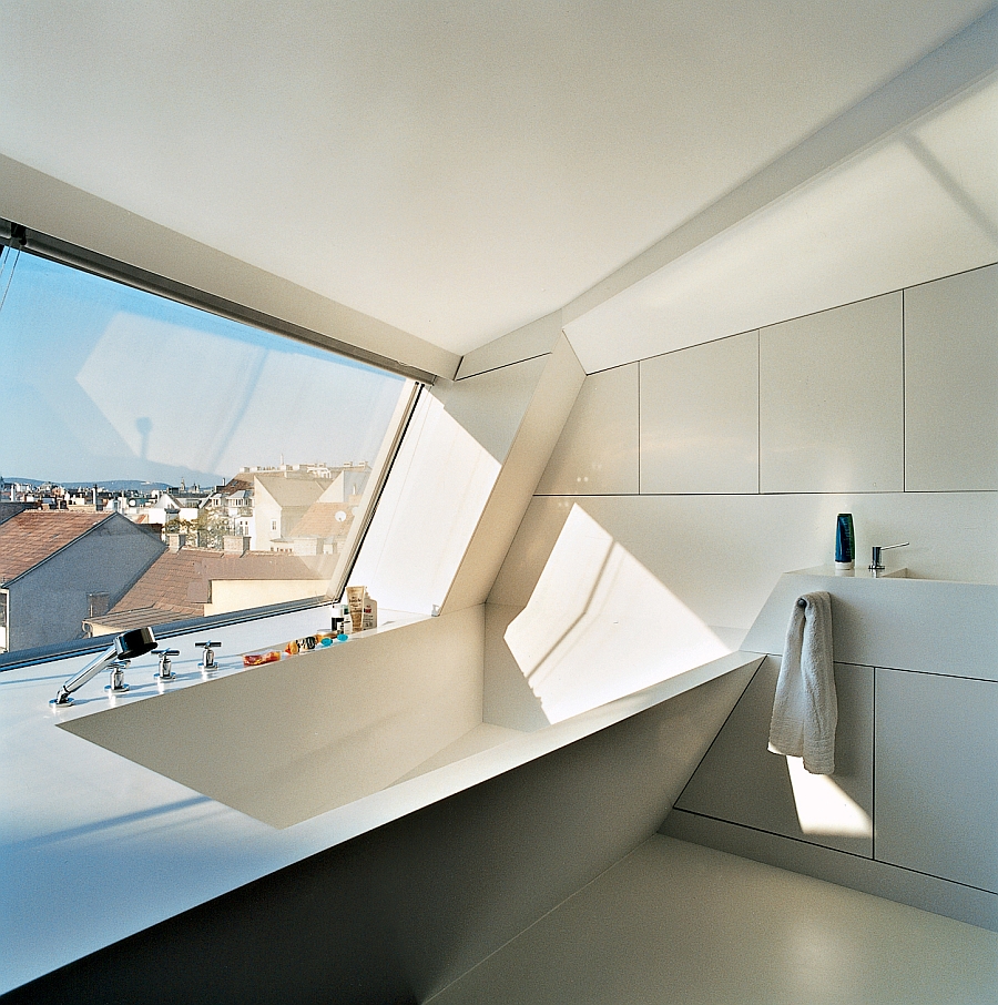 Ultra-modern bathroom with white Corian bathrub