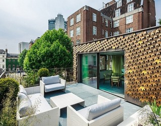 Elegant London Residence Dazzles With A Glittering Bronze Leaf Facade!