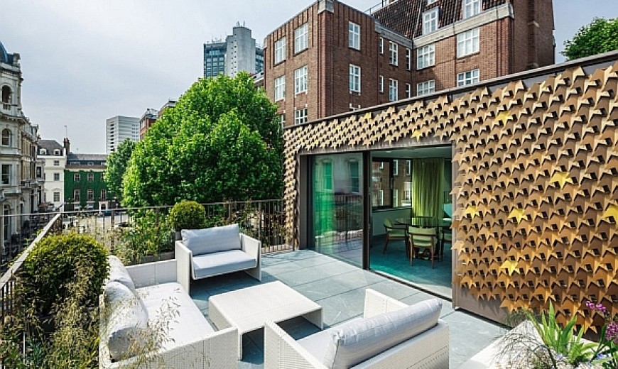 Elegant London Residence Dazzles With A Glittering Bronze Leaf Facade!