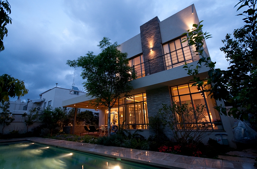 Warmly lit exterior of the Ramat HaSharon home