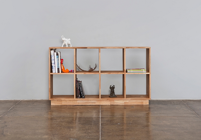 Wooden bookcase doubles as room divider and display