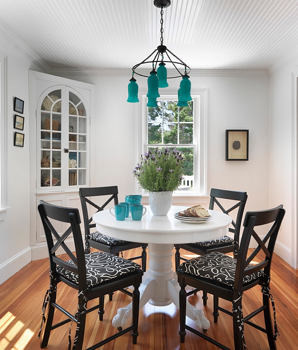 Beach style dining room with captivating pops of turquoise