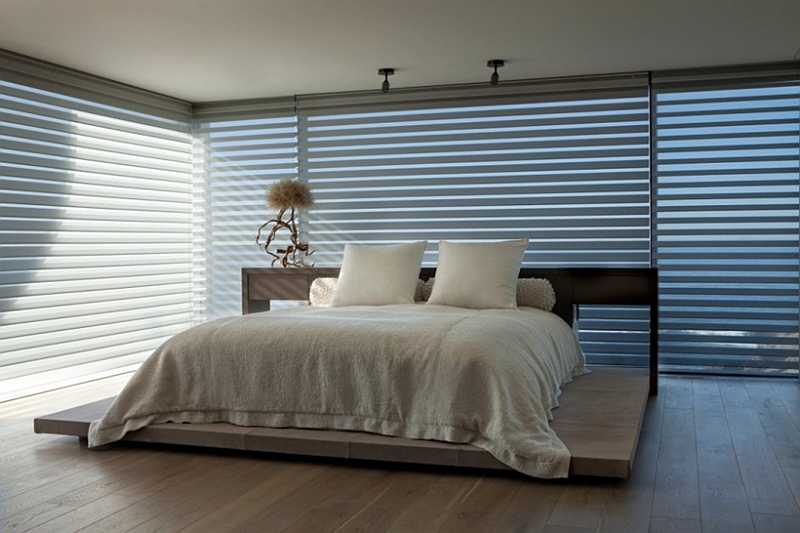 Bedroom with blinds for glass doors